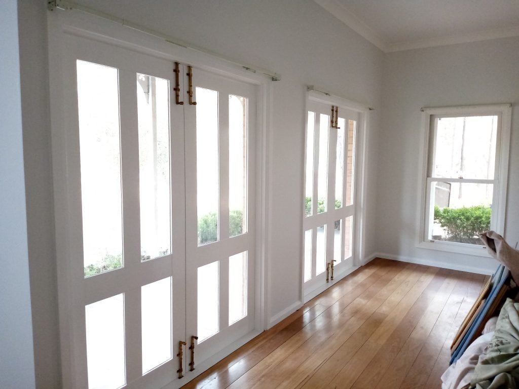 freshly painted interior of a home with big glass doors